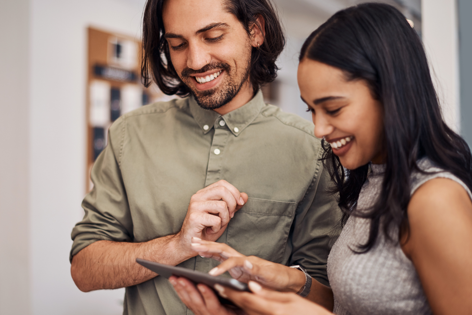 Picture of two people looking at a tablet together